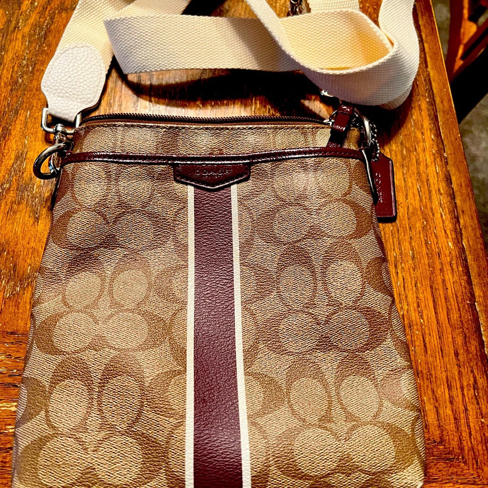 Small Coach crossbody. Brown with dark purple stripe.